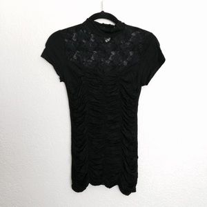 High-necked ruched top with lace detail.