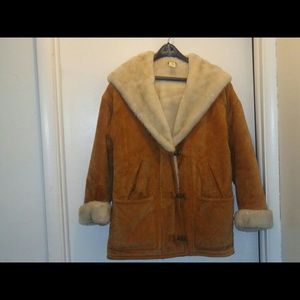 Tan 100% leather with blank lining mid length coat
