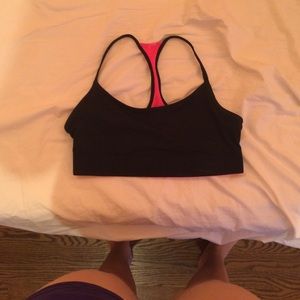 Pink and black reversible sports bra