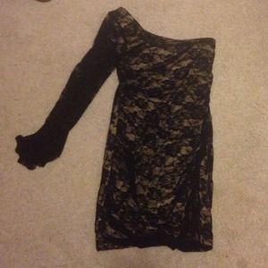 A one strapped gold and black rose body dress.