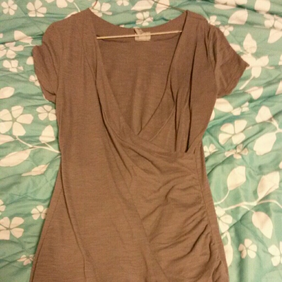 Grey v-neck shirt.