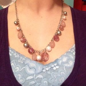 Necklace with pink, pearl, and silver colors.