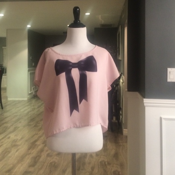 Pink top with black bow