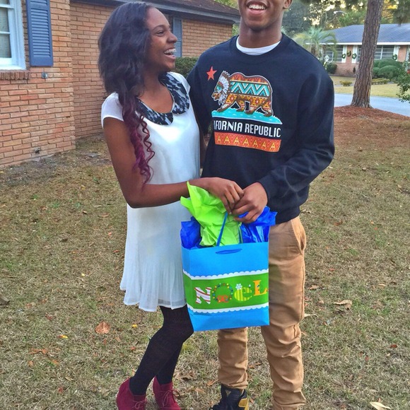 cream dress with black lace collar.