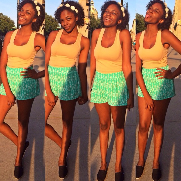 teal Aztec print shorts.