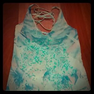 Sky blue dress with irregular cut bottom.