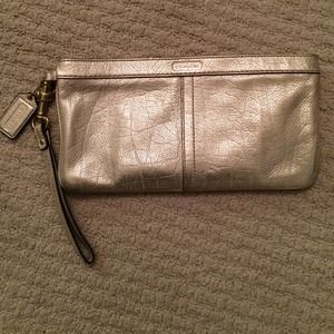 Gold metallic Coach clutch