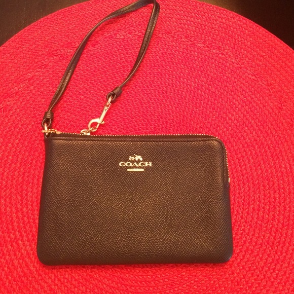 Solid black coach wristlet. BRAND NEW