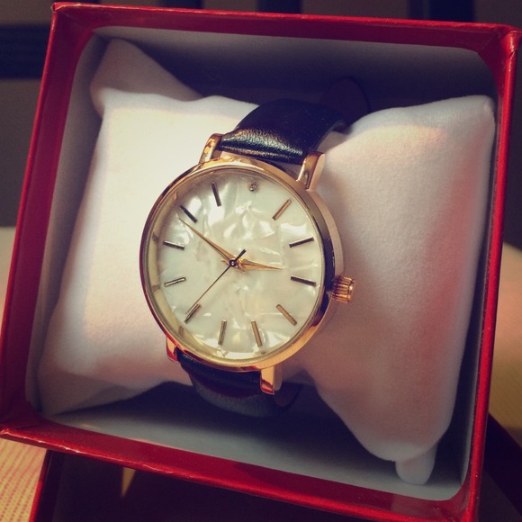 Never-worn faux mother of pearl watch
