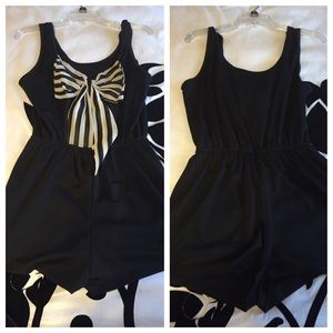Black romper with cute bow on the back!