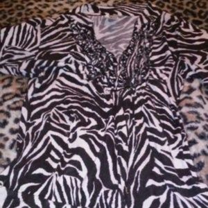 Zebra dress shirt with ruffles on collar.