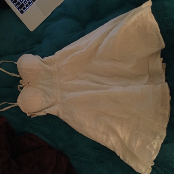 I am selling this lemon back off white sun dress