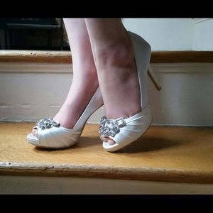 White heels with gem detail