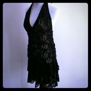 Black lace halter dress with a beige under slip