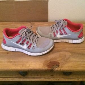 Gray and pink nike free run 5.0