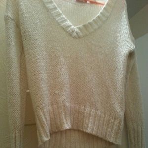 White sparkly-ish sweater.