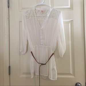 Cream colored top with lace.