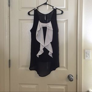 Black high-low with bow sleeveless top.