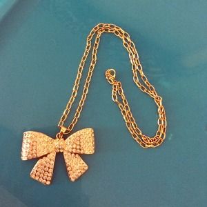 Guess gold rhinestone bow necklace
