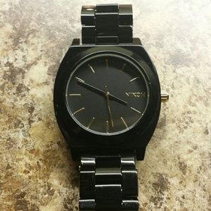Black and gold accent Nixon women's watch