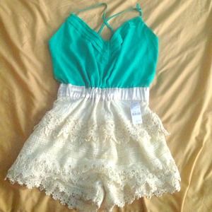 Aqua jumper with lace on the bottom