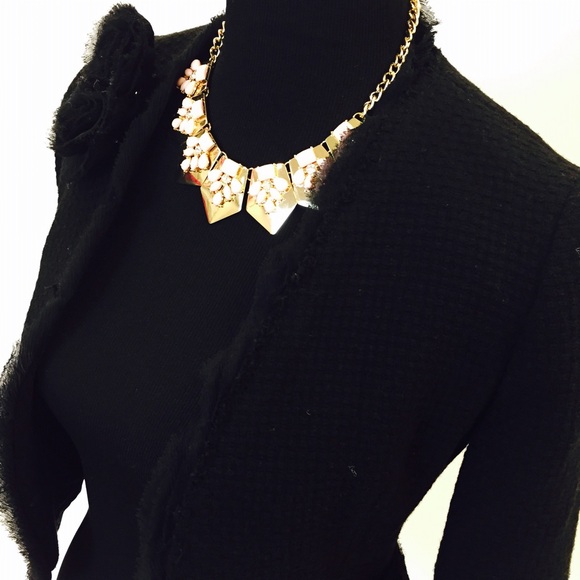 Black cropped jacket with lace detailing on collar