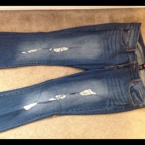 Torrid light washed distressed jeans.