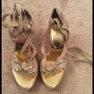 Tan Tie up Wedged Suede Espadrilles.