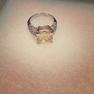 Faux yellow diamond cocktail ring.