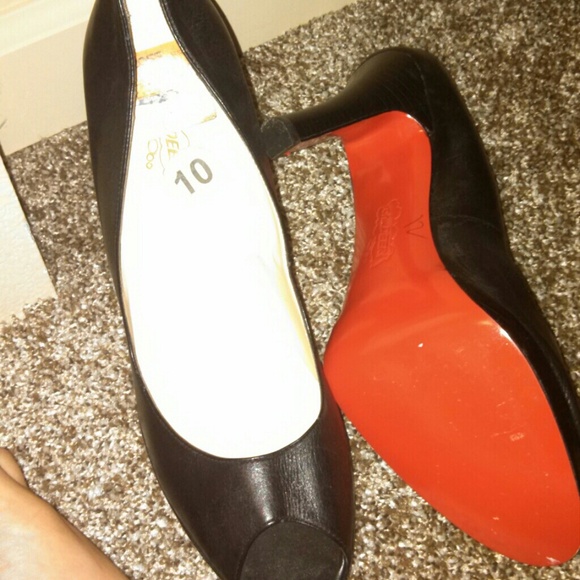 Black opened toe heels.