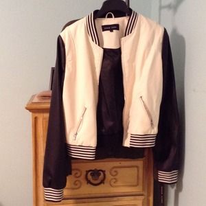 Black and white leather varsity jacket.