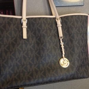 A brown Mk tote ON HOLD