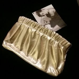 DONNA KARAN GOLD CLUTCH OR COSMETIC CASE.