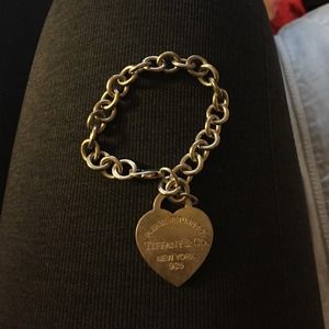 Please return to tiffany big tag bracelet