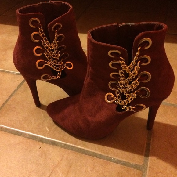 Red suede ankle heels with gold chains