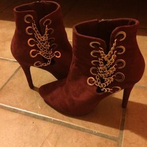 Red suede ankle heels with gold chains