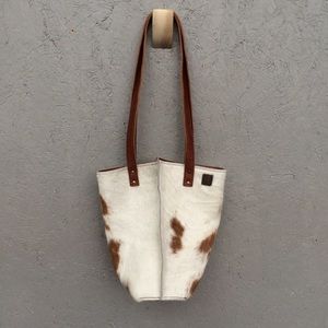 Beautiful brindle leather bucket tote.