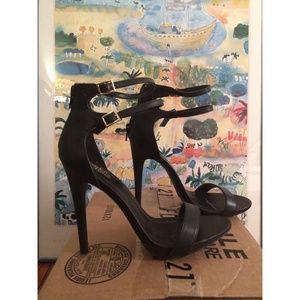 High heeled black sandals