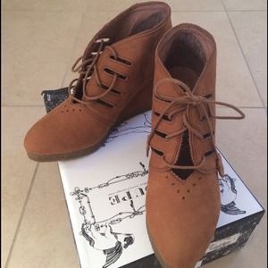 Lace-up suede booties with a 3 inch wedge