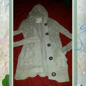 Silver grey sweater.