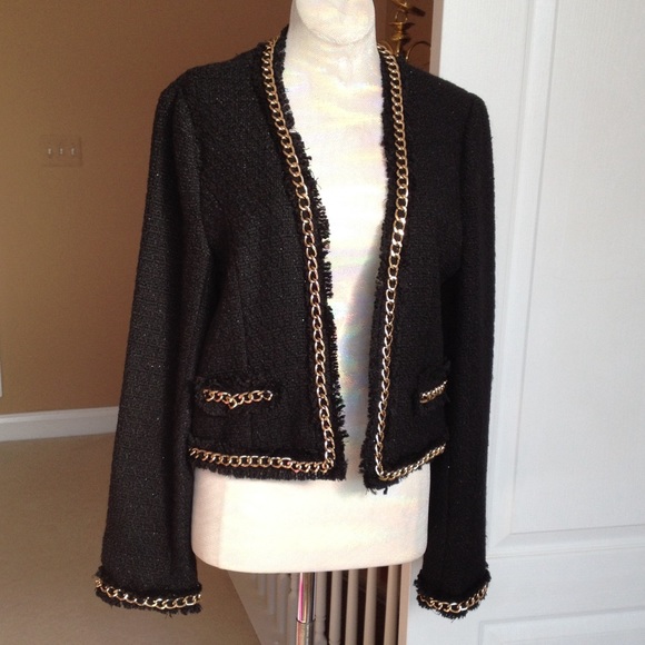 Black blazer with gold metal chain trimming.