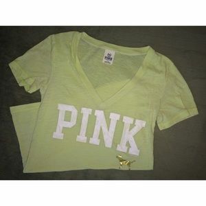 Pink V-neck shirt.