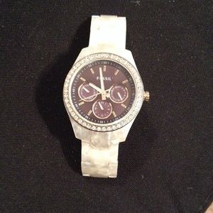 Pearl Fossil watch with black face and gold trim