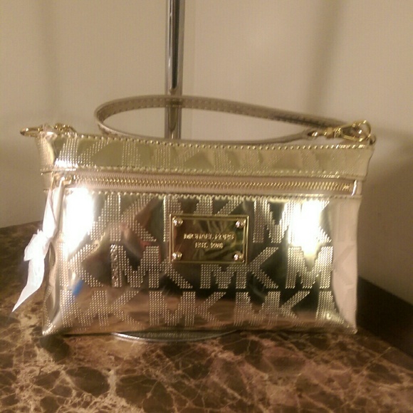 SOLD.....Authentic Michael Kors pale gold wristlet
