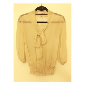 Sheer blouse with bow and lace detail