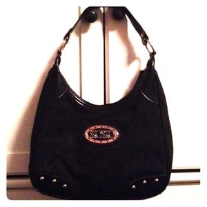 Never used XOXO purse.