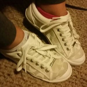 White Authentic Coach shoes.
