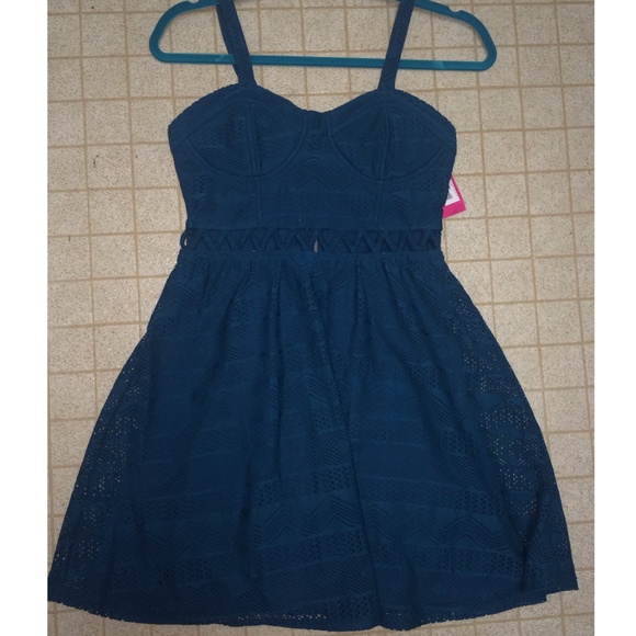 Teal dress with Aztec print & front-only cut outs