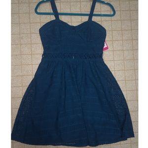 Teal dress with Aztec print & front-only cut outs