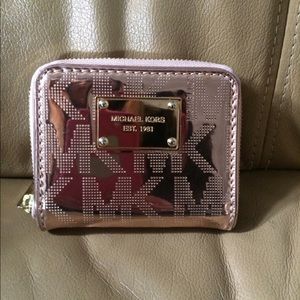 ***SOLD***Rose gold MK zip around wallet.